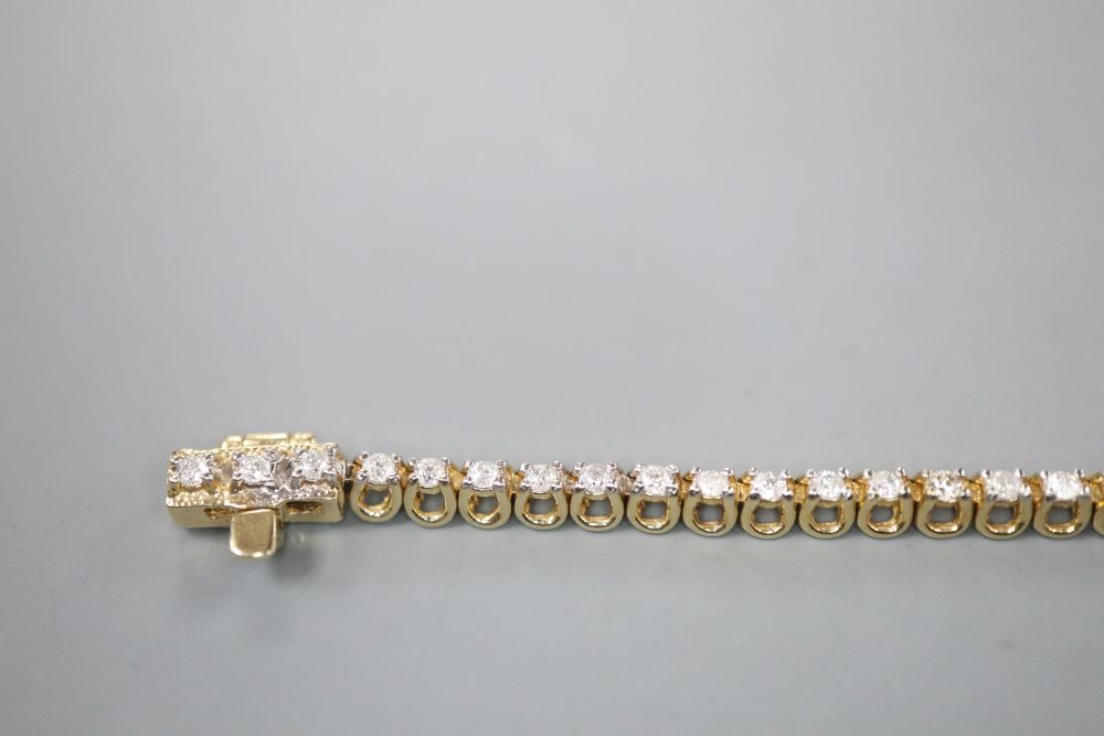 A modern 9ct gold and diamond set line bracelet, 17.7cm, gross 7 grams,